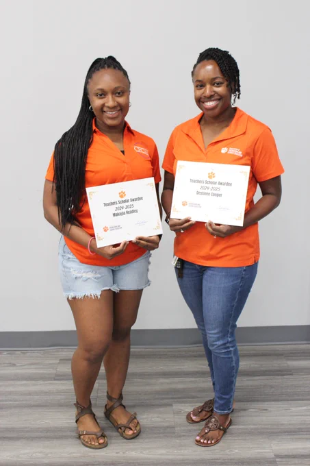 Makayla Headley (left) and Destinee Cooper (right) pose with their Teacher Scholar Awards.