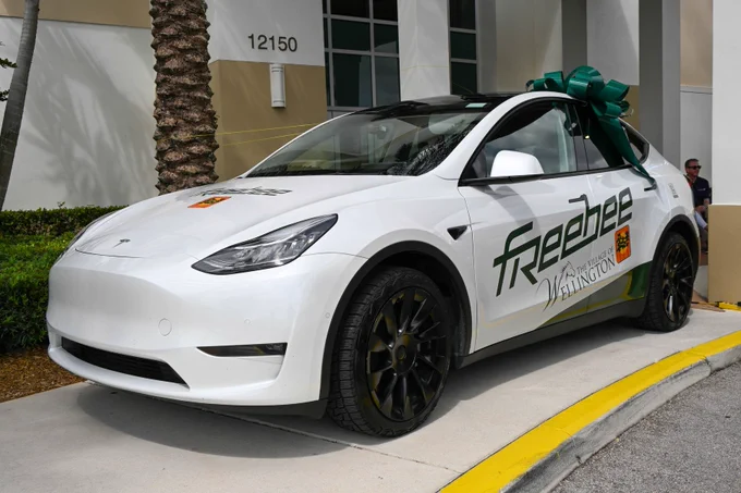 Vehicle with freebee and Village of Wellington logo on the side.