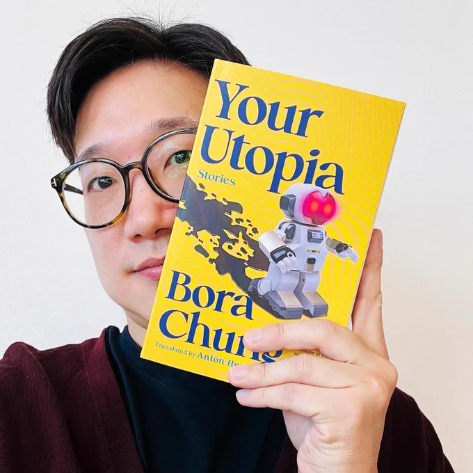 Me, holding a copy of YOUR UTOPIA