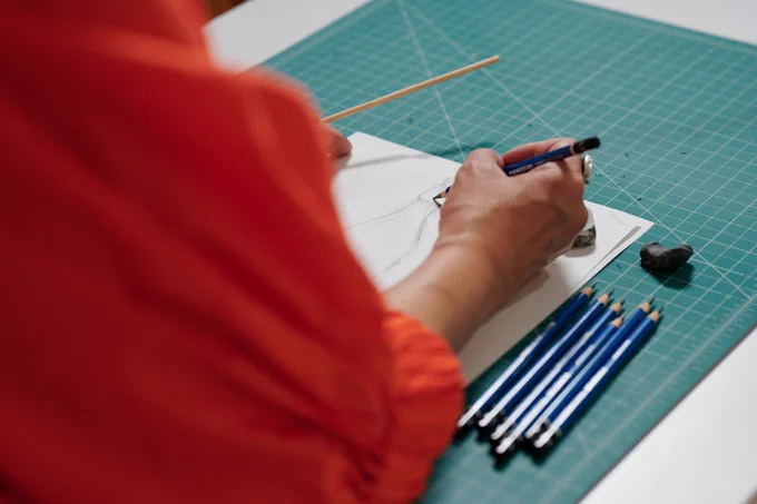 Close-up of a person drawing with her right hand