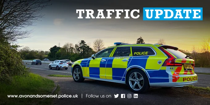 A marked  police car and the words "traffic update".