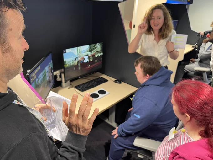 Google Employee Miya showing a man how to use eye gaze gaming