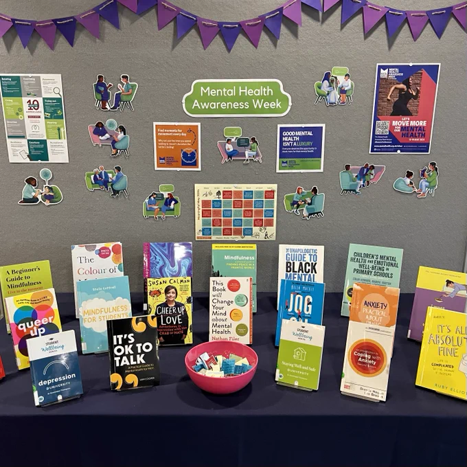 A display showing books and resources around mental health and mindfulness.