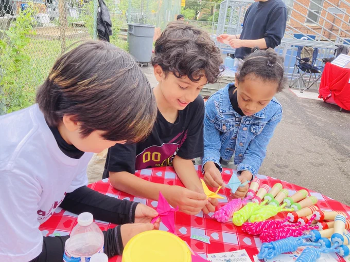 Kids make origami at last year's Earth Day Fair.