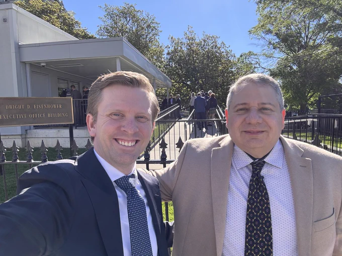 Joe Devon, co-founder of Global Accessibility Awareness Day, and Ben Ogilvie, Head of Accessibility at ArcTouch, smile while taking a selfie outside of the Eisenhower building before Joe will speak at a GAAD event at the White House in Washington, DC.