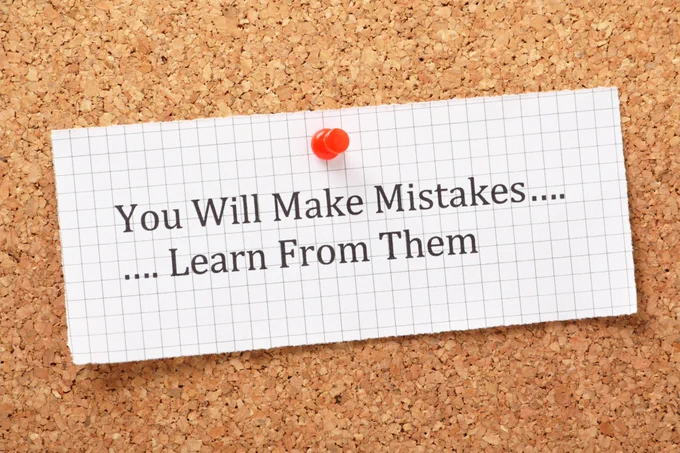 A note saying "You will make mistakes... learn from them" is pinned to a cork board.