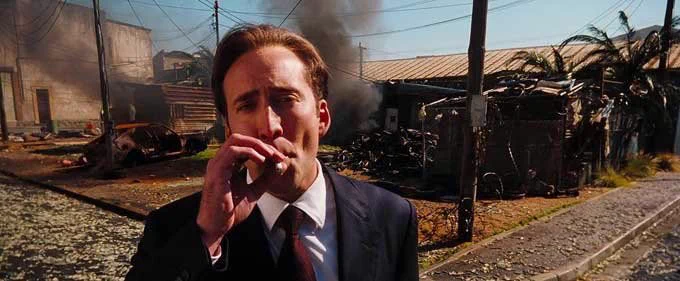 Nice Cage smoking cigar at start of Lord of War movie