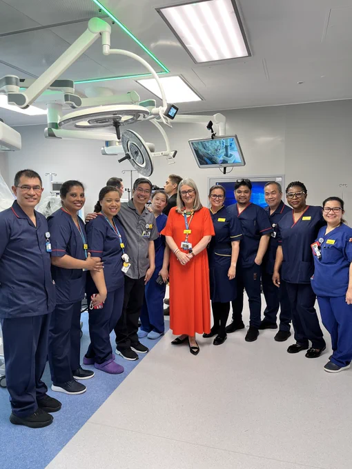 Our Chair Jacqui Smith with staff at the opening
