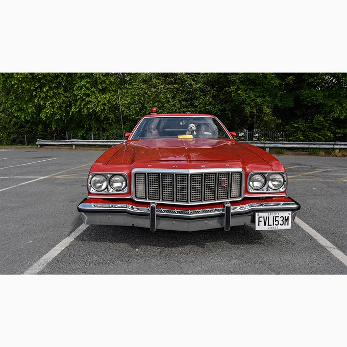 Picture of an 1974 Ford Gran Torino automobile painted like the one used in the 1970s Tv show Starsky and Hutch.