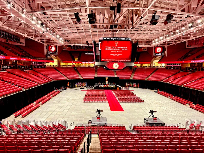 Photo of empty but decorated arena for commencement