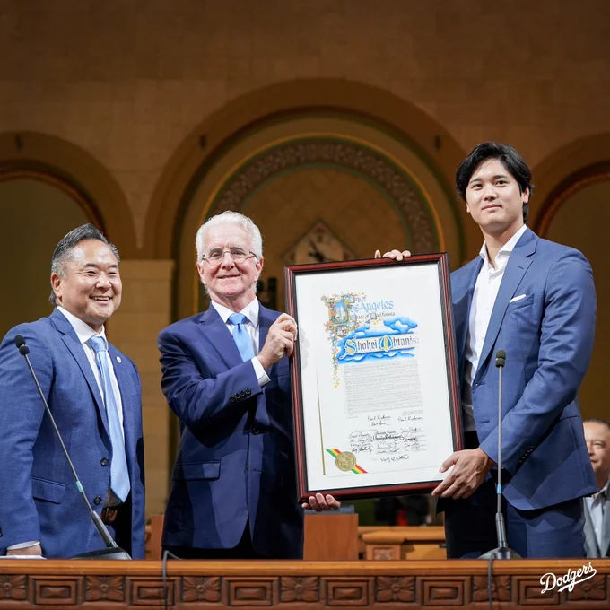 Shohei Ohtani poses for a photo with a resolution declaring May 17 as Shohei Ohtani Day in Los Angeles.