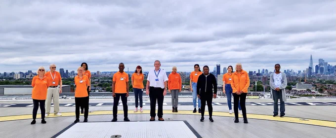 Image of some of King's Volunteers Services standing on top of the Helipad at King's College Hospital.