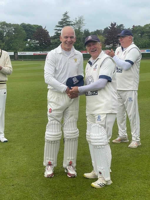 Richard Merriman presenting Paul Radage with his cap
