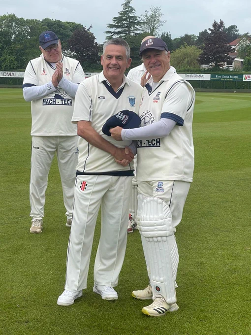 Richard Merriman presenting Lee Selfe with his cap