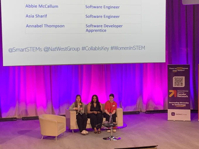 Abbie, Asia and Annabel sitting on a sofa on stage for a panel discussion