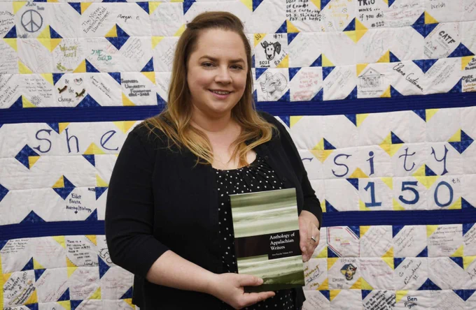 Julie Shehan, editor for the Anthology of Appalachian Writers, holds the 16th volume of the anthology