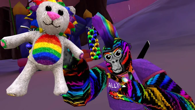 A Gorilla Tag monke avatar in a rainbow striped skin wearing a purple "ALLY-gator" shirt and holding a pride lion plushie. The monke is wearing a rainbow mohawk and the Clouds map can be seen in the background.