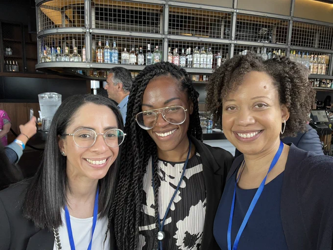 Three women smiling