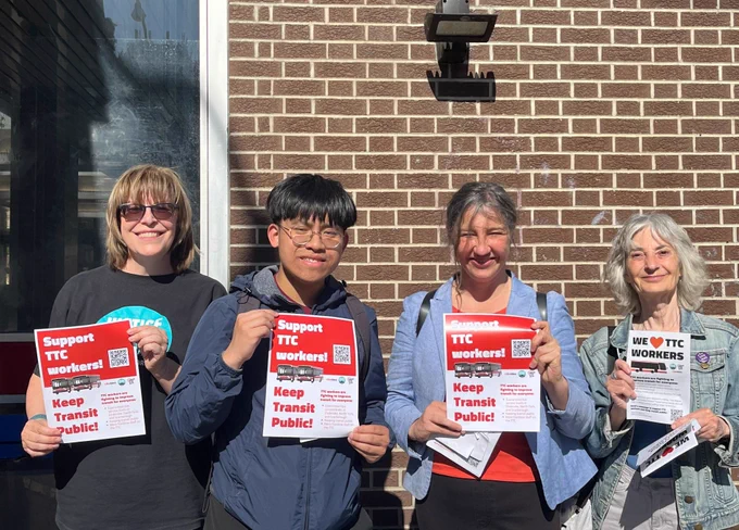 Four people are holding up signs that say: SUPPORT TTC WORKERS! KEEP TRANSIT PUBLIC! MPP Jessica Bell is in the photo, who was out alongside TTC Riders and Justice for Workers to collect signatures on a petition and hand out leaflets. 
