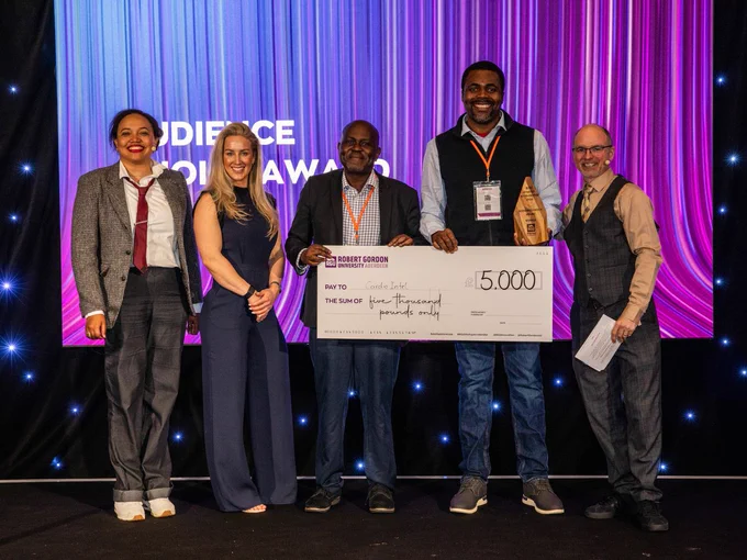 Cardio Intel winning one of their awards alongside Aisha, Sheli and Chris