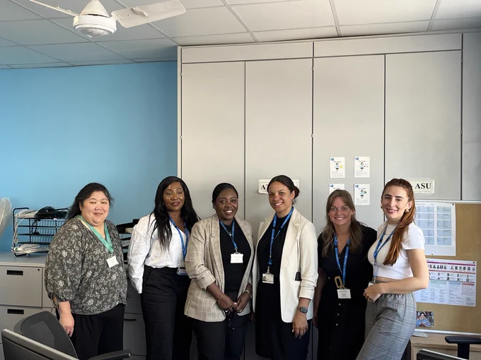 Team photograph of HR colleagues at Imperial College Healthcare. Staff are standing in a row and smiling towards the camera.