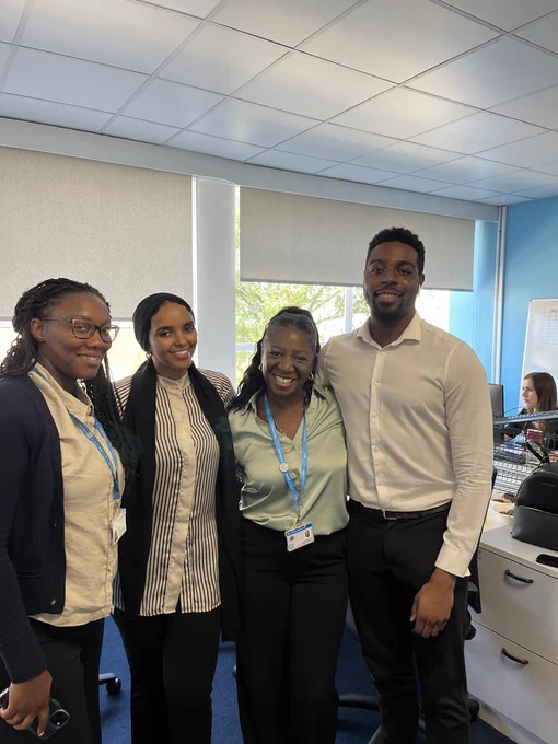 Team photograph of HR colleagues at Imperial College Healthcare. Staff are standing in a row and smiling towards the camera.