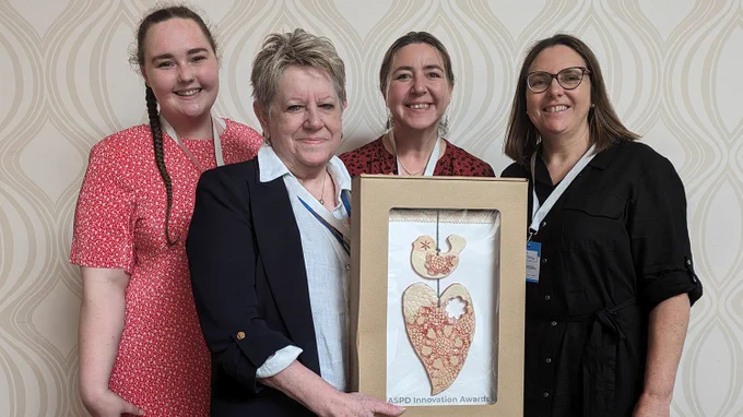 A photo of the team holding their EASPD 2024 Innovation Award