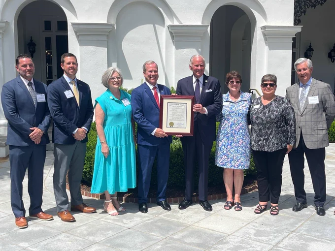 Darlington Raceway President Josh Harris (second from left) was part of a sports industry group during South Carolina Governor Henry McMaster’s proclamation of the Palmetto State’s “Travel and Tourism Week.” McMaster (fourth from right), hold the proclamation along with Duane Parrish, Director, South Carolina Department of Parks, Recreation & Tourism.