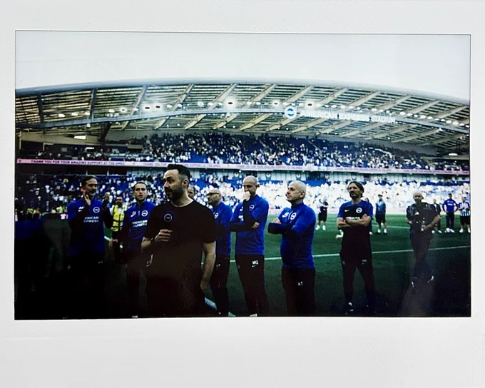Polaroid picture of De Zerbi giving a speech at the Amex at his final game in charge of the Albion.