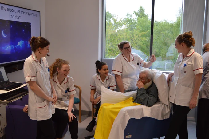 A patient taking part in singing sessions for the Speech and Language Therapy team. 