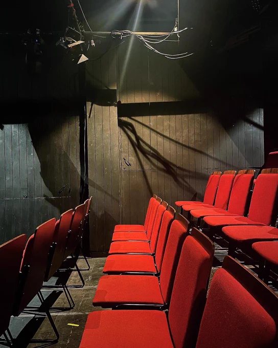 Red theatre seats in Camden People’s Theatre