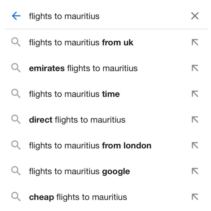 A google search shows suggestions for 'Flights to Mauritius'