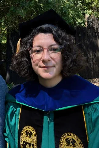 Picture of Dr. Juniper Lovato in UVM academic regalia