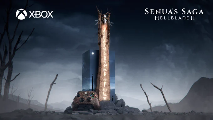 Image of a custom Xbox Series X designed with a 'Senua's Saga: Hellblade II' theme, including a matching controller and stand. The stand features a Lorestangir Viking totem and a replica of Icelandic terrain, set in a misty, barren landscape reminiscent of Iceland. The Xbox wordmark is displayed in the top left corner, and the 'Senua's Saga: Hellblade II' logo is in the top right corner.