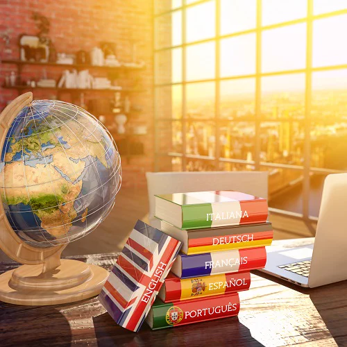 A globe of the world and language books