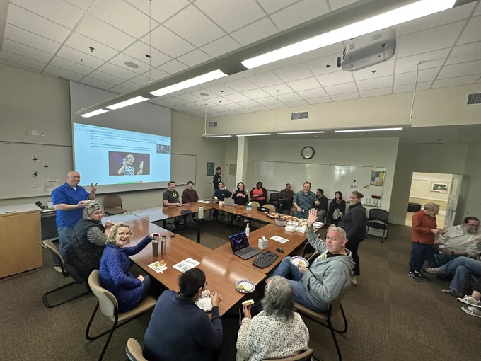 The PBISApps team in a conference room celebrating the launch of SWIS Suite for iOS and Google Play.