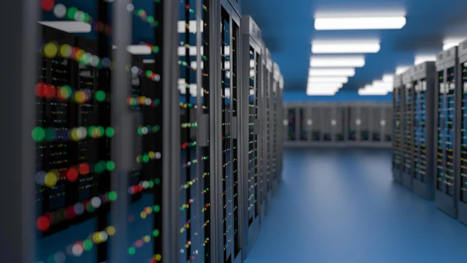 Rows of server racks in computer data centre
