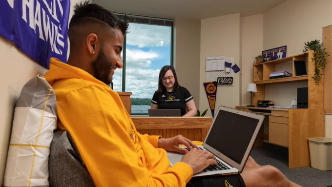 Two students work on computers in Brantford residence