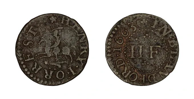 Circular brown token, on one side is written Henry Forrest, around a picture of St Geroge riding left, sword raised, wyvern under the horse. On the other side is In Blandford 1663 around the initials H F. British Museum 1863,0202.15