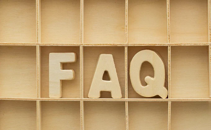A wooden case with the letters F, A, Q in the middle