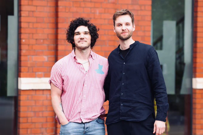 Actors Fra Fee and Sion Daniel Young standing outside Chapter Arts Centre.