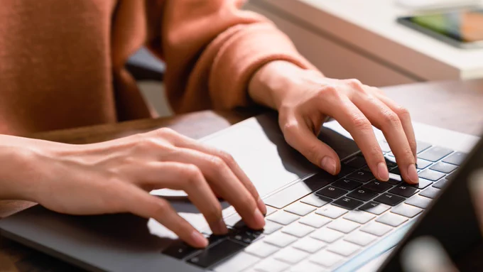 Image of hands typing on a keyboard