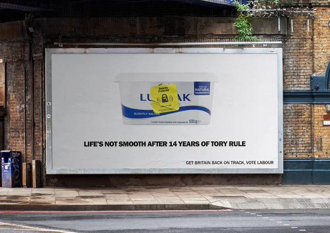 Image of a tub of butter with a yellow supermarket security tag - text below reads "Life's not smooth after 14 years of Tory rule" and "Get Britain back on track, vote labour"