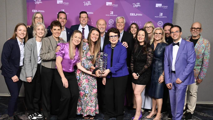 Ilana Kloss, Jana Hefford, Billie Jean King, Stan Kasten, Mark Walter, Royce Cohen, and Amy Scheer stand with PWHL leadership and staff on-site in front of the SBJ Sports Business Awards backdrop.