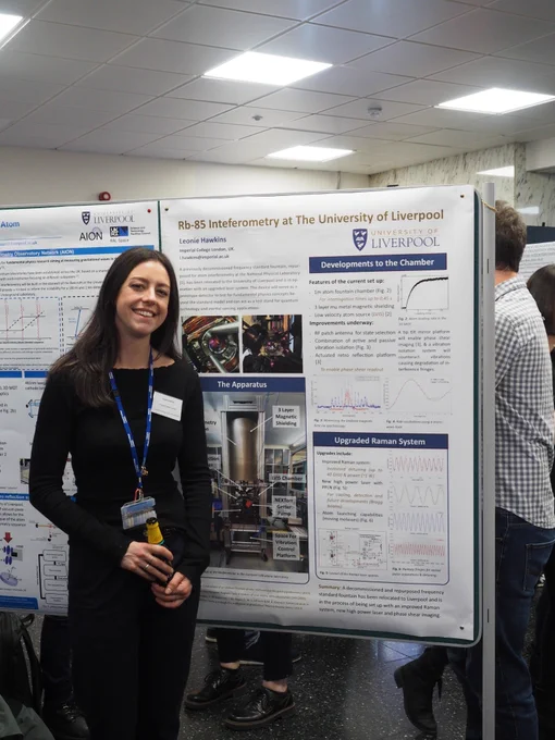 Leonie stands next to her poster, 'Rb-85 interferometry at the University of Liverpool'