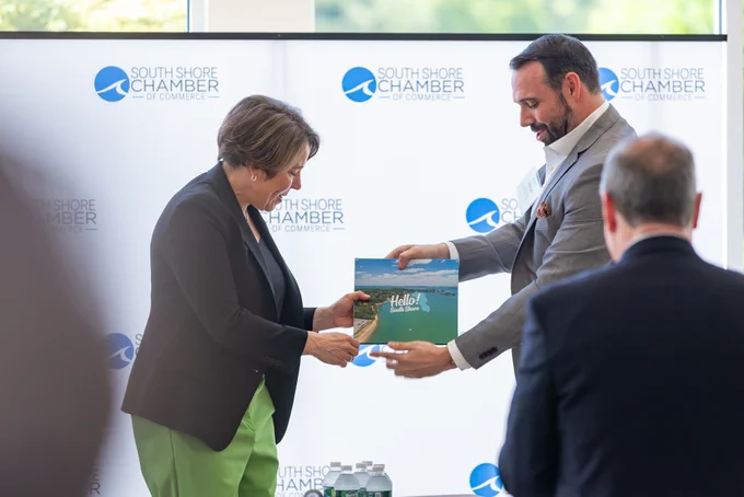 Governor Healey accepting South Shore gift. 