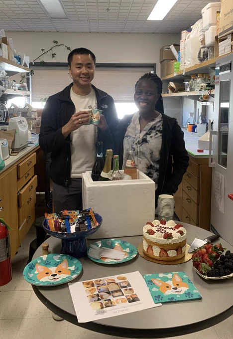 PhD candidate Jia Zheng Woo and Primary Investigator Flora Rutaganira celebrating with a toast