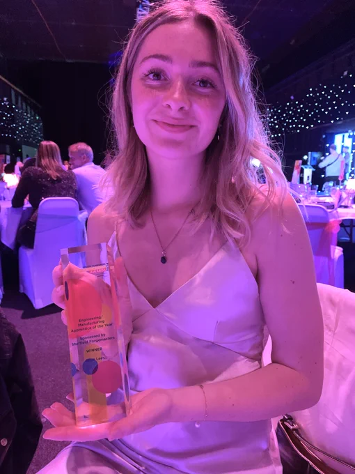 AMRC Training Centre degree apprentice, Alice Lees holding a trophy 