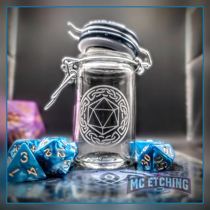 Small glass jar etched with a d20 dice design 