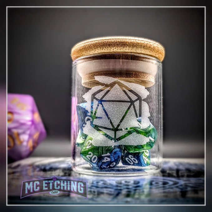 Small glass jar etched with a d20 dice design and filled with gaming dice